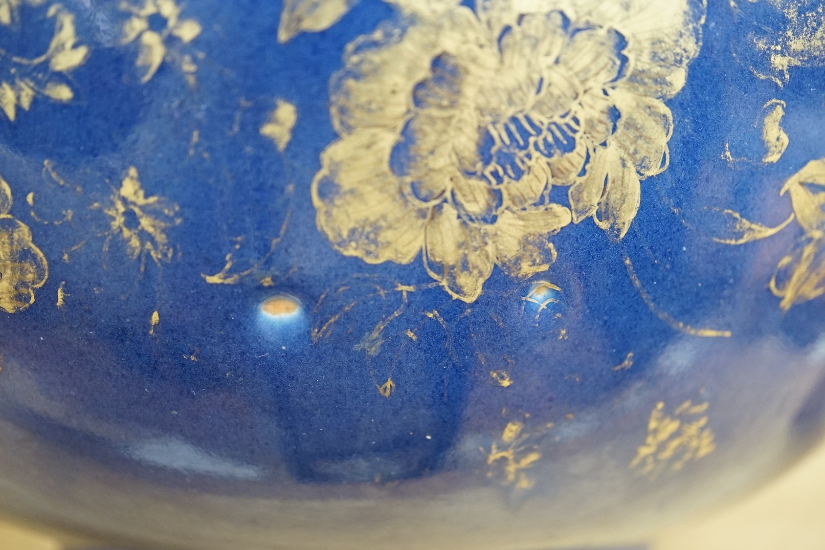 An 18th century Chinese gilt decorated powder blue glazed bowl, 26cm diameter